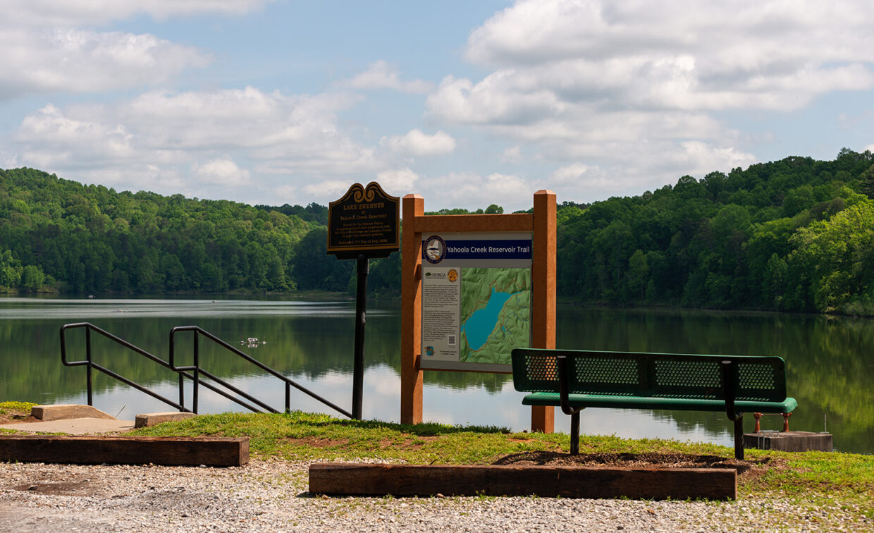 Image an informational map with a lake in the background.