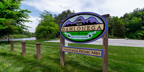 The sign at Wimpy Mill Picnic Area with the lake in the background