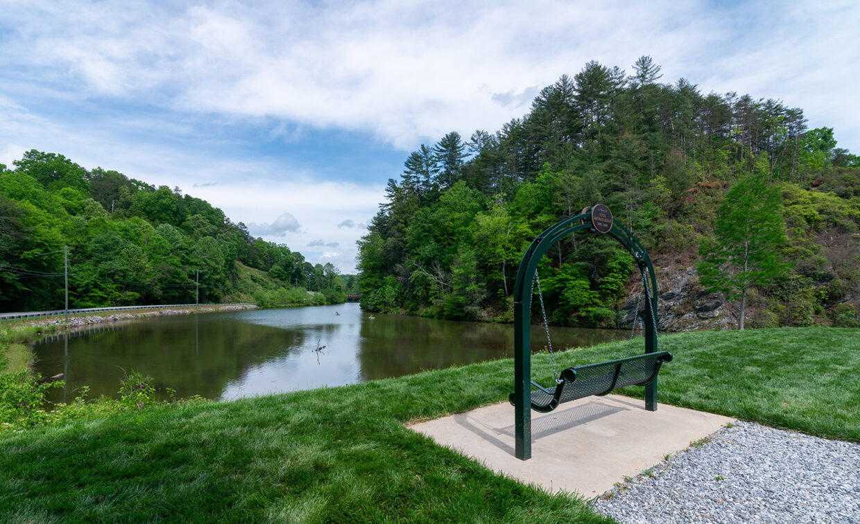 Image of a bench over looking a body of water.